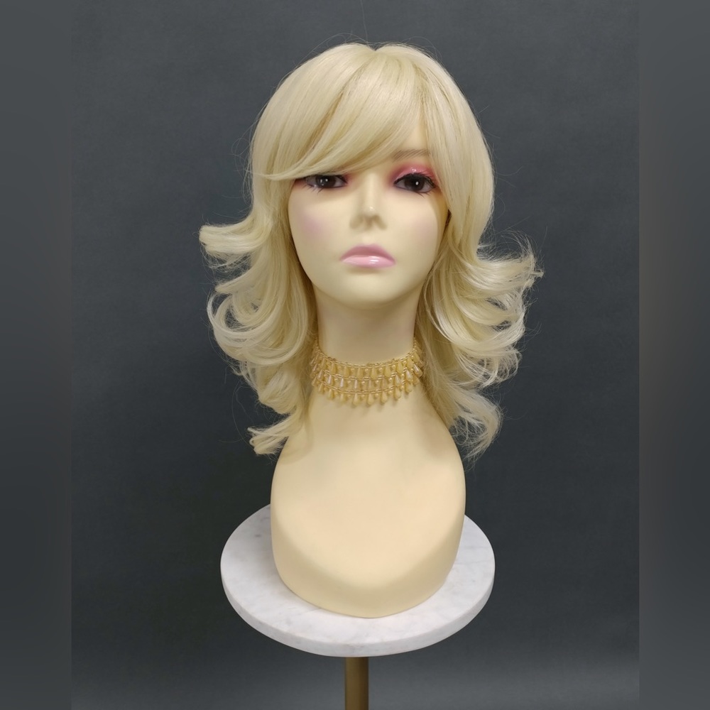 Blonde heat resistant wavy wig with bangs